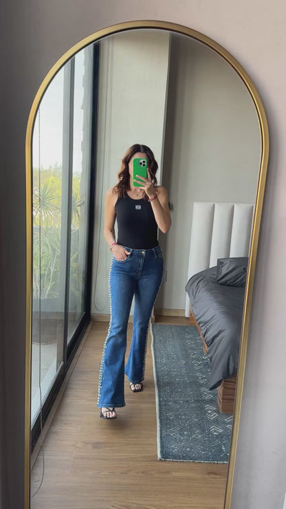 Jeans con studs laterales